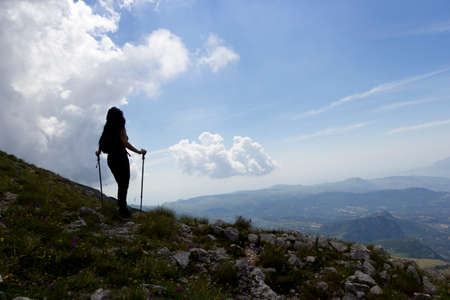 woman hiker on green mountainの写真素材