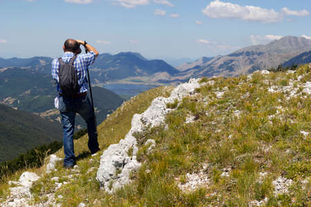 Hiker on mountain trailの写真素材