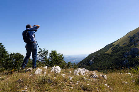 Hiker on mountain trailの写真素材