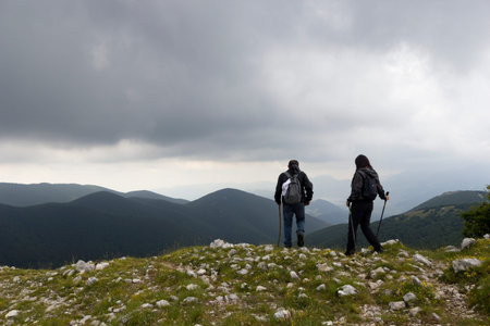 man and woman hikers on mountain