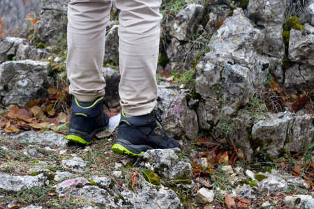 hiker legs on peak of mountainの写真素材