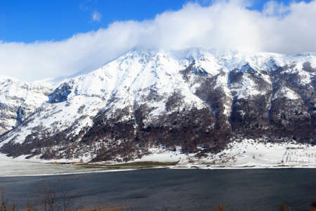 view of mountain lake with snowの写真素材