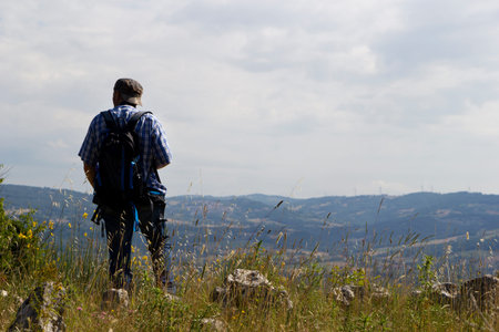 Hiker on the summit of a mountainの写真素材