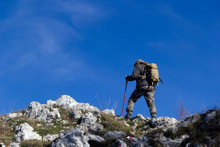 hiker on mountain peak mutria in italy matese
