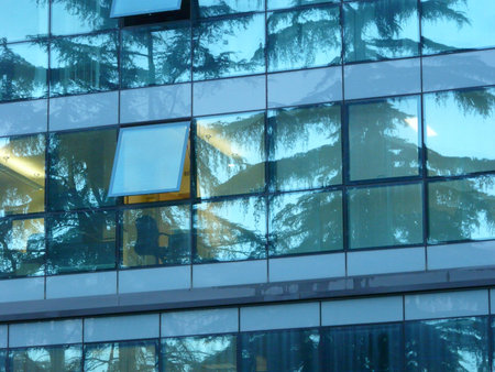glass building facade in modern skyscraper and reflex