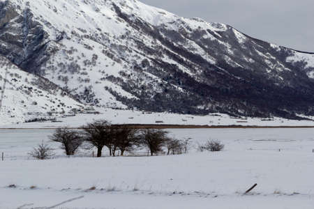 mountain landscape with snow and iced lakeの写真素材