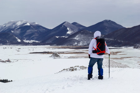 hiker on mountain and snow