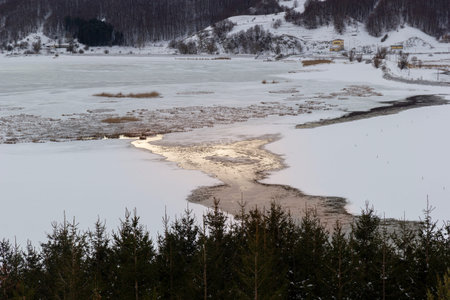 mountain landscape with snow and iced lakeの写真素材