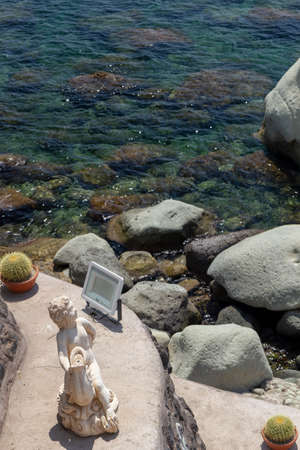 transparent sea with rocks in ischia forioのeditorial素材