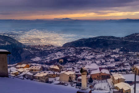 san gregorio matese mountain village with snow at sunsetの写真素材