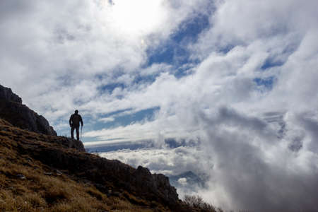 hiker on the top of a mountainの写真素材