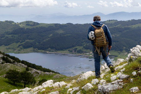 hiker in the mountains with lake in matese park