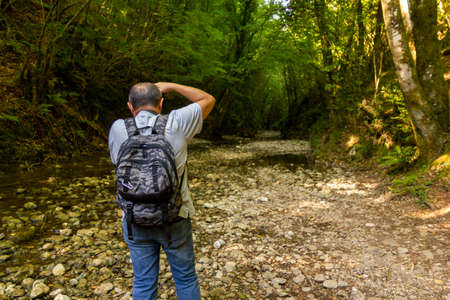 hiker take a photo in the woods trekking in Varo della Spina to Montella Avellinoの写真素材