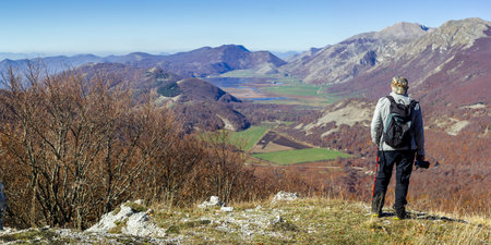 hiker in the mountains with lake in matese parkの写真素材