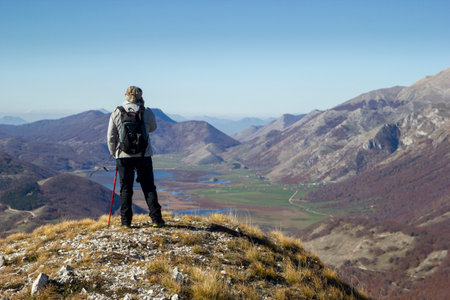 hiker in the mountains with lake in matese parkの写真素材