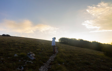 hiker on the mountain summit at sunrise in the Matese parkの写真素材