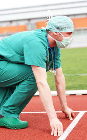 Doctor surgical clothing on starting position in stadium competition first aidの写真素材