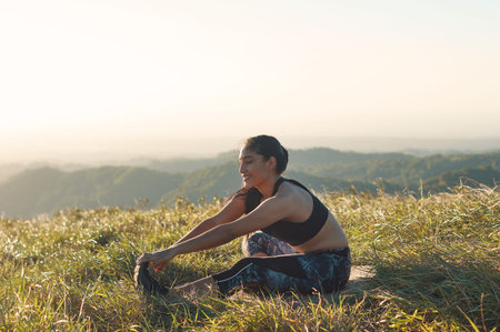An image of woman wearing sporty clothes and stretching her body healthy and active