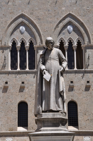 Statue, Salimbeni square in Sienaの写真素材