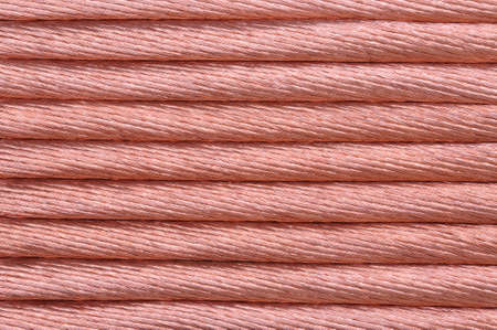 Copper wire for the power industry, red backgroundの写真素材