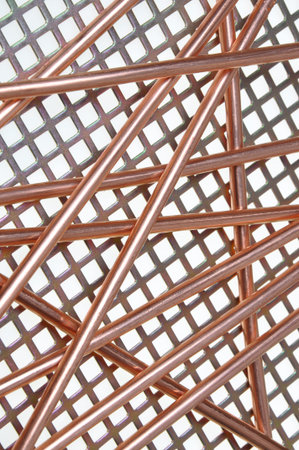 Copper wire on metal grid の写真素材
