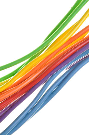 Bundles of electric computer cables on a white background の写真素材