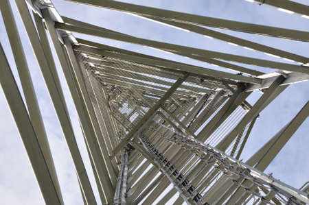 Construction of tower against blue skyの写真素材