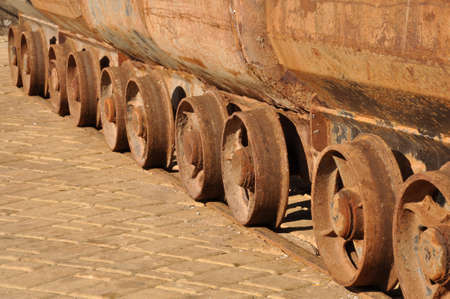 Raw of weels of old mine carts の写真素材