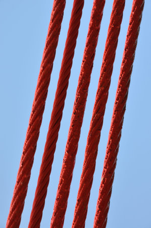 Steel lines of the bridge against the blue sky 