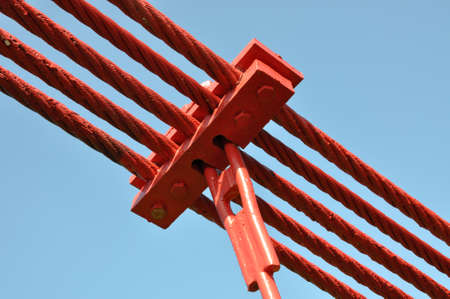 Steel lines of the bridge against the blue sky の写真素材