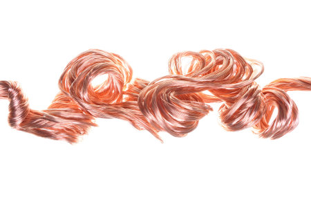 Red copper wire, industrial object on a white background の写真素材