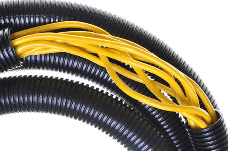 Corrugated pipe withe cables isolated on white background の写真素材