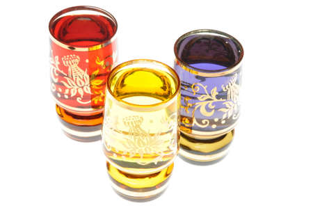 Liquor in glasses isolated on white backgroundの写真素材