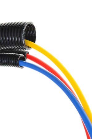 Power supply cables in corrugated pipe isolated on white の写真素材