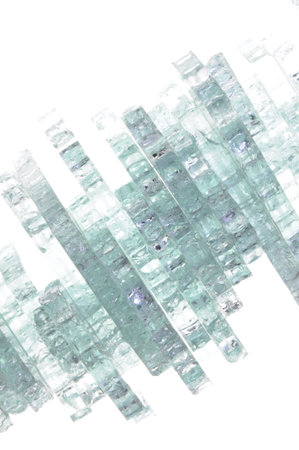 Pieces of broken glass on white background の写真素材