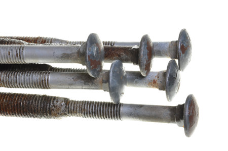 Old screws head bolts, isolated on white backgroundの写真素材