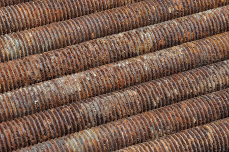 Long rusted bolts as background 