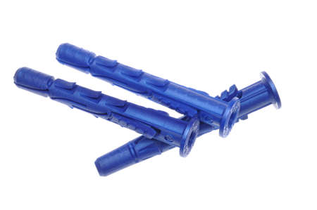 Blue plastic dowels on isolated white backgroundの写真素材