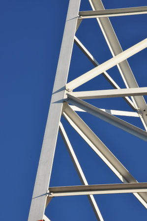 Construction of a telecommunications tower against the blue sky