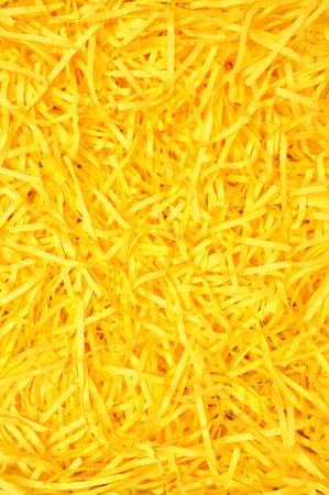 Yellow shredded paper as backgroud, packaging material