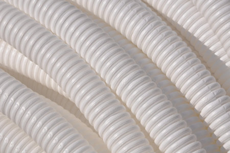 White plastic corrugated pipe as background