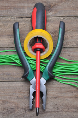 Tools for electricians for electrical installations, pliers, tape and screwdriverの写真素材