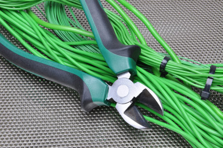 Electrical tools and cables on metal surface