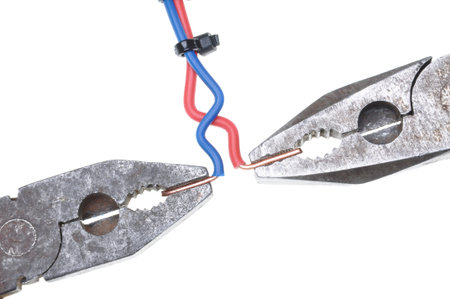 Combination pliers with electrical wire isolated on white background