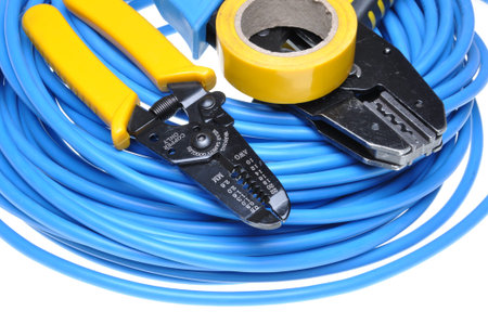 Crimping tool and cables isolated on white background