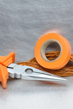 Tools and electrical component on metal surface with place for textの写真素材