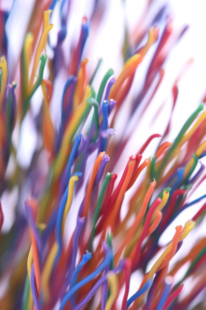 Bunch of colorful copper cables blurred abstract technology