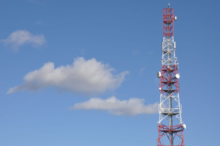 Telecommunication tower against the blue sky