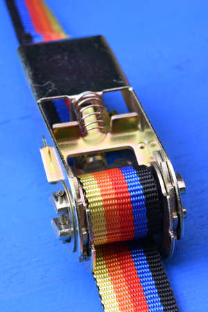 Ratchet straps on blue backgroundの写真素材