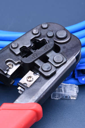 Crimping tool with cable for computer networkの写真素材